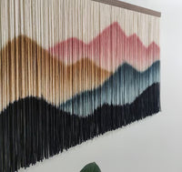 Boho wedding backdrop featuring handmade macrame dip dye art