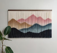 Large fiber art wall hanging in living room bohemian interior